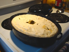 Typical Lac-Saint-Jean-style tourtière in a deep, oblong metal casserole or roaster pan ready to be cooked © Encyclopedia of French Cultural Heritage in North America