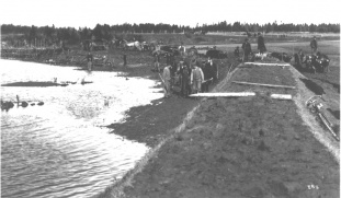 Workers Building a Levee and an Aboiteau-style dike (1900)