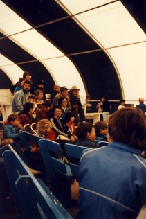 Spectators inside the marquee at the 6th annual Fête Fransaskoise in Batoche in 1985