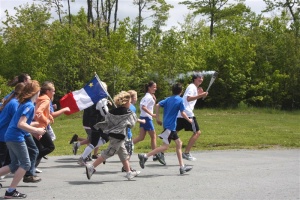 Flame being carried to the Jeux de l’Acadie at Petit-Rocher, NB, 2009