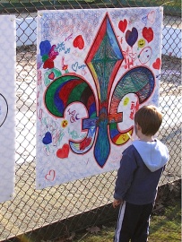 Child looking at a mural at the Festival du Bois, Maillardville, 2008