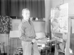 The painter E. Holgate before one of his Lac-Tremblant landscape paintings, © BAnQ