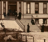 Society members pose for a photograph in front of the early college in 1890 (detail) 